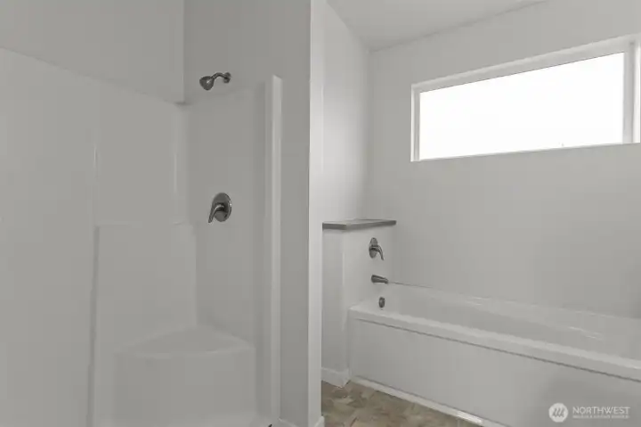 Shower and Soaking tub of the Primary bedrooms' en suite bathroom