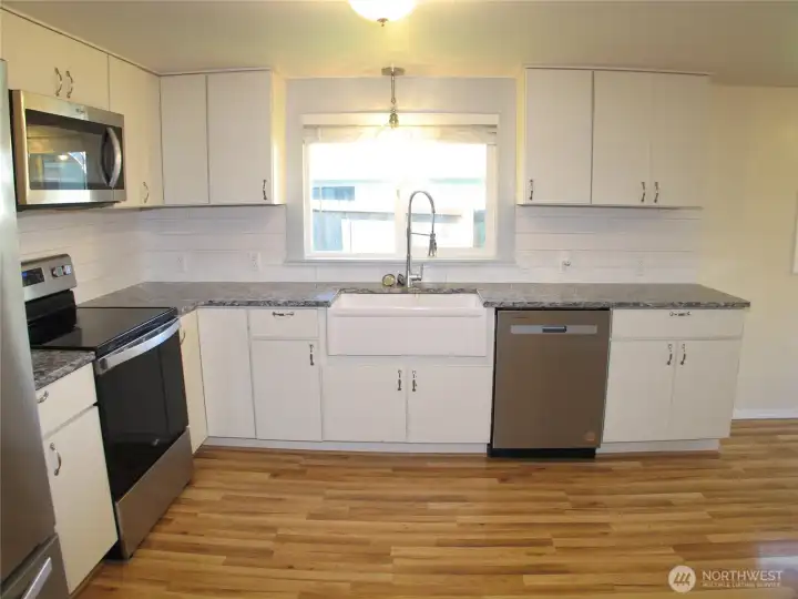 Newer appliances with farm house sink.
