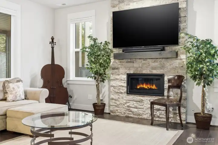 Cozy up next to the fire for movie nights in the Living Room area. High-end details grace this residence.