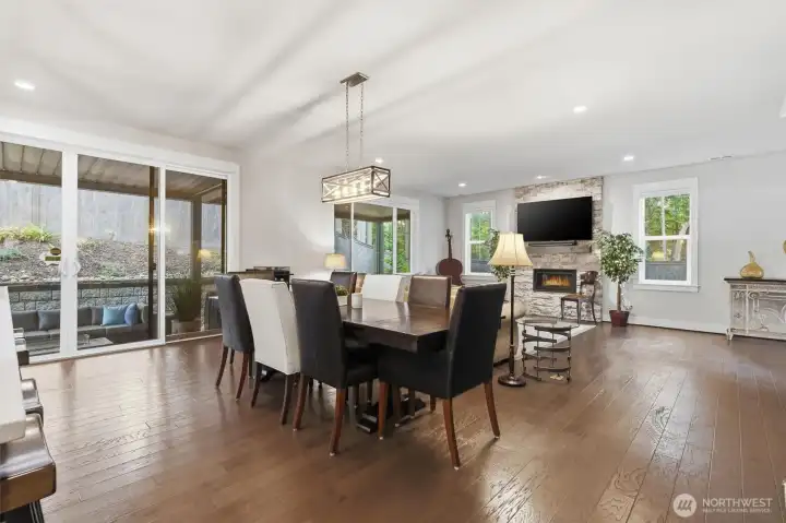 Dining area flows seamlessly to outdoor covered patio area beyond double slider.