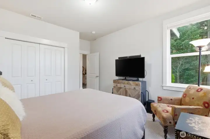 Main floor bedroom with adjacent 3/4 bathroom.
