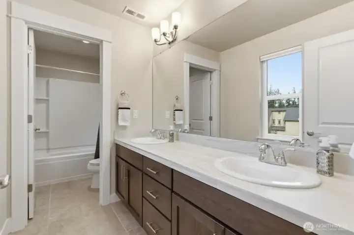 Upper level full bathroom adjacent to Bonus Room and bedrooms.