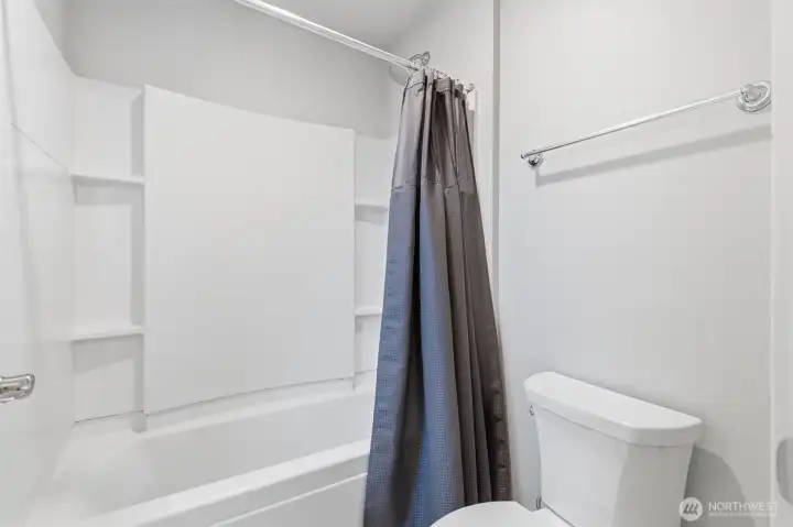Upper level bathroom shower/tub combination.