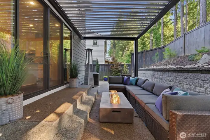 Covered patio with automated roof to let in the sun during the summer months and allows you to enjoy the outdoors all year round.