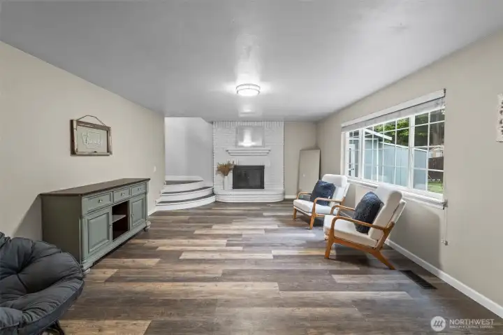 Cozy family room with fireplace just off of the kitchen. 13911 113th Ave Ct E, Puyallup, WA 98374