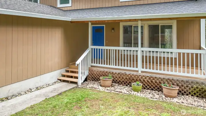 Freshly painted front deck with covered entry