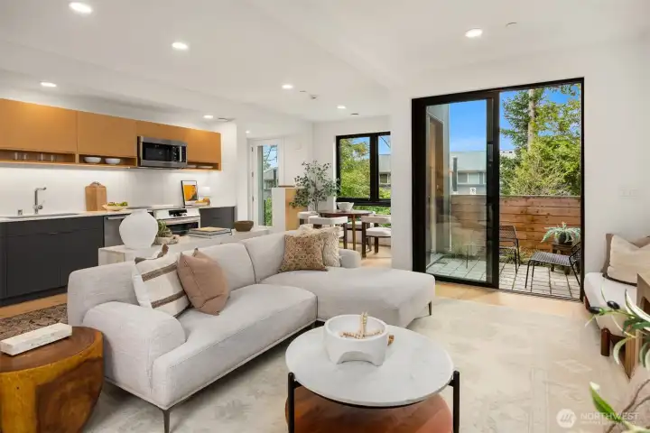 The great room is designed to seamlessly blend with the outdoors and kitchen, creating a harmonious flow that's perfect for both indoor and outdoor entertaining.