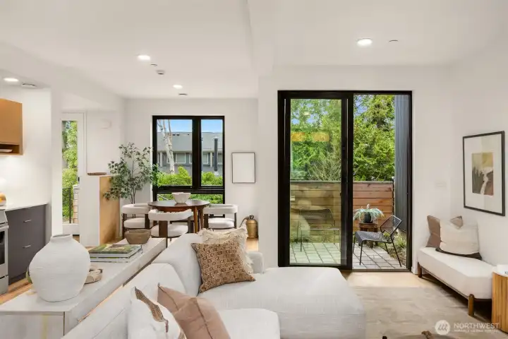 Large windows and sliding glass doors flood the interiors with natural light.