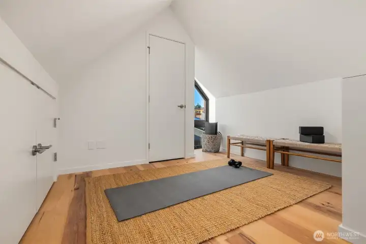 Bonus attic loft space offers flexible use—ideal for extra storage or a quiet retreat for yoga or meditation.
