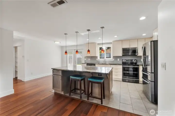 Sleek stainless-steel appliances, featuring a double oven.