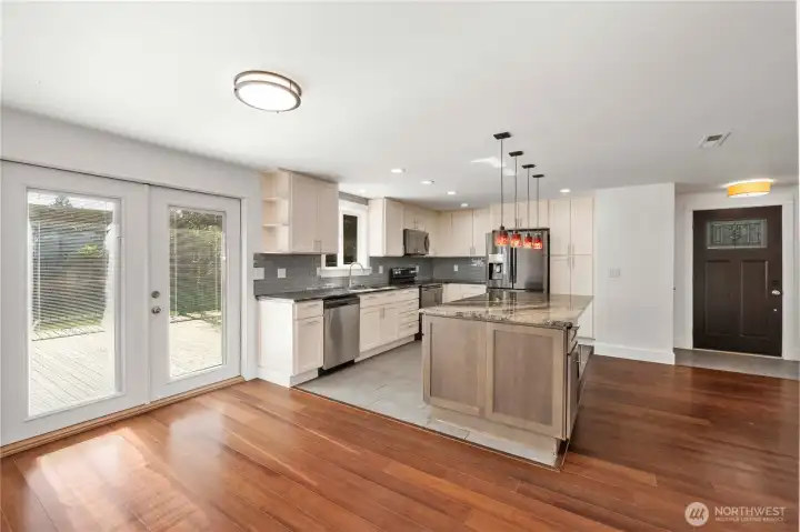 Dining area with French doors open to the backyard deck. Perfect for entertaining!