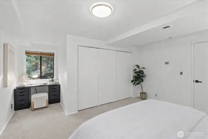 This bedroom features a charming nook, ideal for a work desk or cozy reading chair.