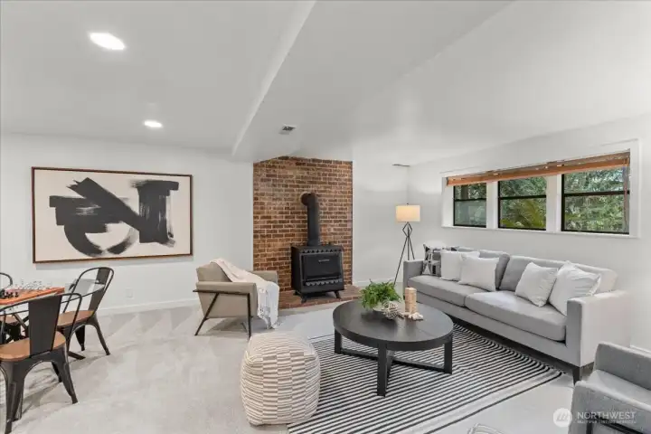 A large lower-level entertainment room perfect for movie nights, gatherings, or game days.