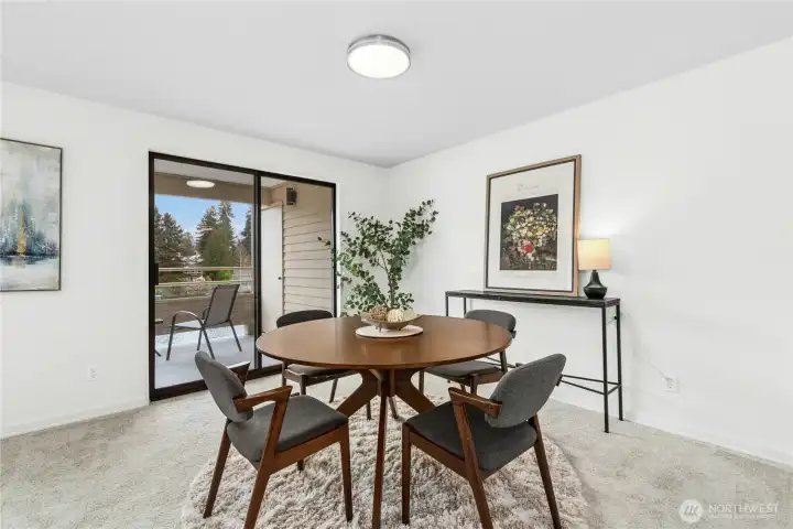 Dining room to balcony with storage room.