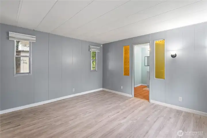 Primary bedroom with a generous ensuite bathroom and walk-in closet offering plenty of storage.