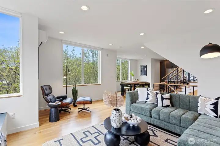 The living room is seamlessly connected to the dining room and kitchen for easy entertaining.