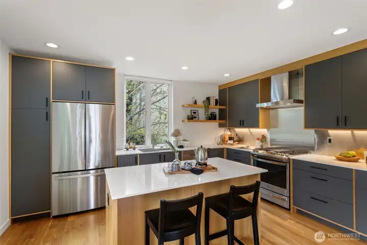 The appliance package is top notch with GE Profile as the brand.  There is a gas cooktop, drawer microwave, stainless steel hood, dishwasher and refrigerator.