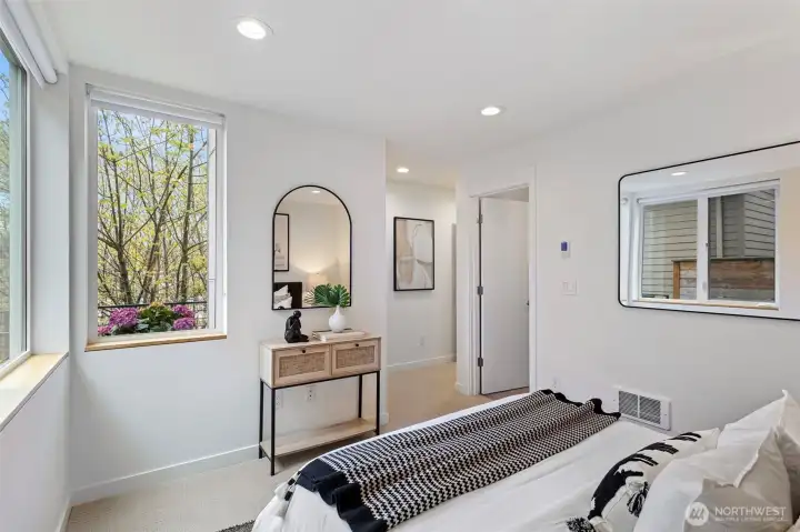 The first level bedroom has two windows letting in maximum natural light.