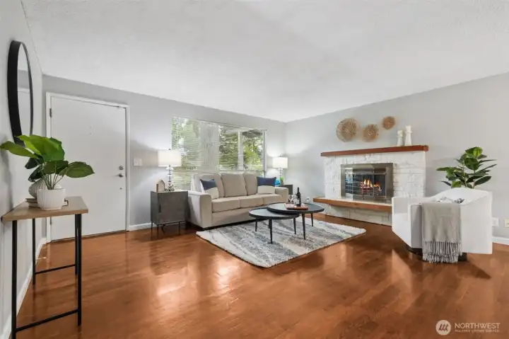 Light-filled living room with beautiful flooring and an open, airy feel.