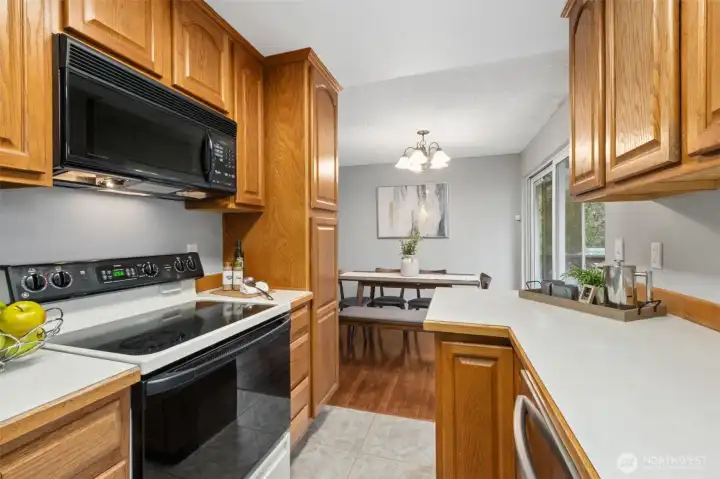 Great storage, workspace, and convenient flow to dining area.