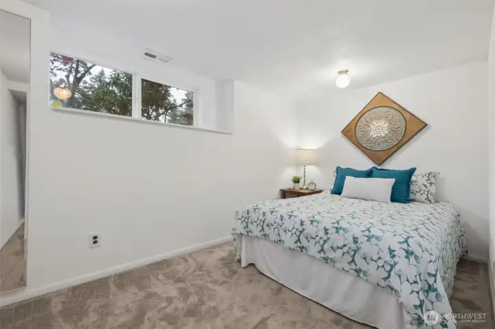 Cozy bedroom with natural light and peaceful atmosphere.