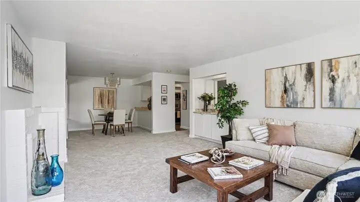 From this angle, the open-concept design seamlessly connects the living room, dining area and kitchen, creating a warm and welcoming space for gatherings.
