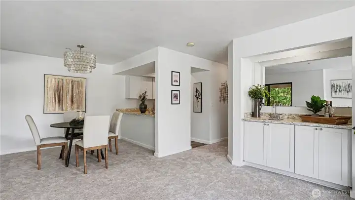 Living room also features a wet bar and extra storage cabinets that add flexibility for hosting or everyday living, would make a perfect coffee bar!