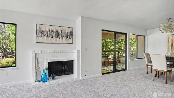 Another angle showcasing the warm and cozy fireplace centerpiece.