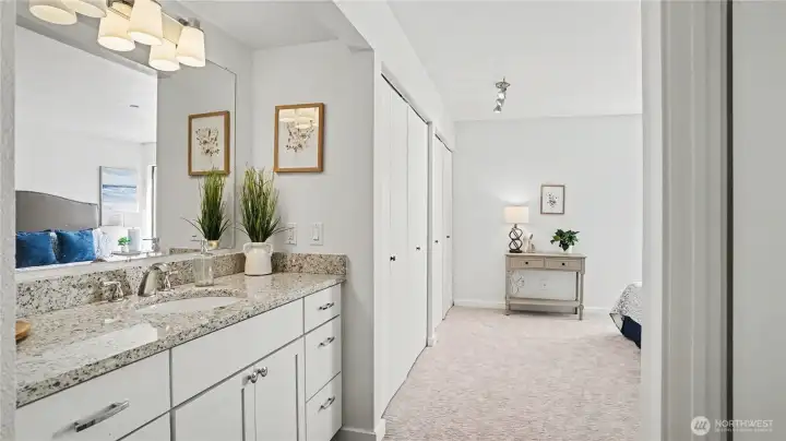 Another view of the primary with sink vanity easily accessible.