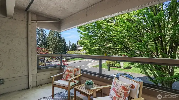 Step onto the private covered balcony, offering a seamless indoor-outdoor living experience year-around.