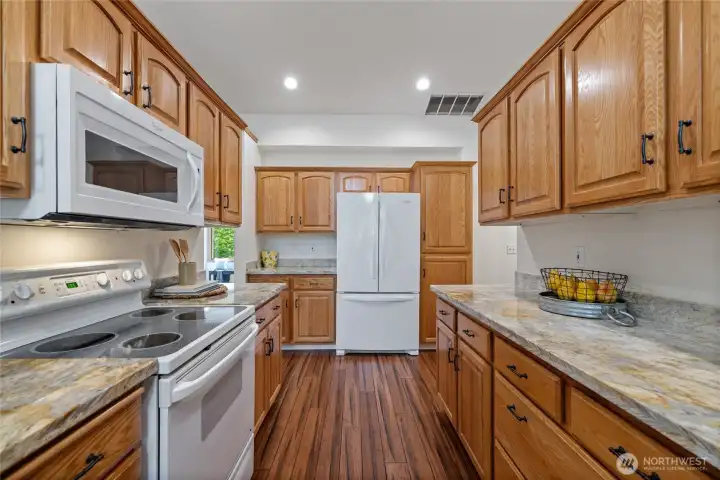 Walk through kitchen, to the right Primary suite and Utility room, to the Entry way, guest bath and bedrooms Walk through kitchen, to the right Primary suite and Utility room, to the Entry way, guest bath and bedrooms