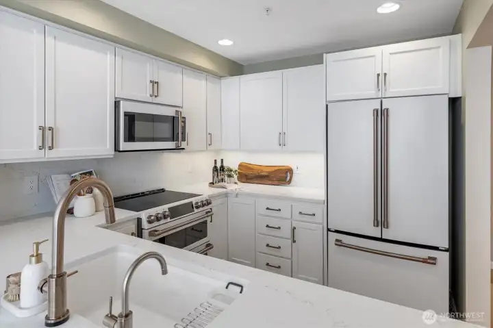 Brushed gold fixtures and cabinet pulls