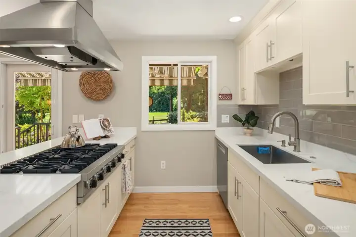 Gourmet kitchen with gas fireplace and quartz countertops. Gourmet kitchen with gas fireplace and quartz countertops.