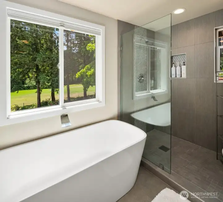 Soaking tub that looks out to a private yard. Soaking tub that looks out to a private yard.