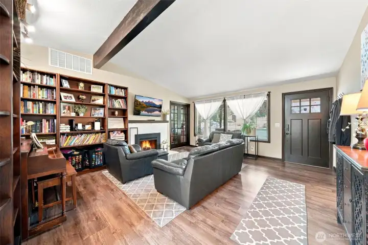An inviting living room & entry with gas fireplace An inviting living room & entry with gas fireplace