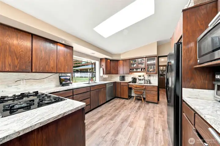 Vaulted ceilings & a skylight in the kitchen too Vaulted ceilings & a skylight in the kitchen too