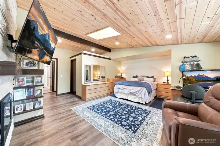 A luxurious primary bedroom with fireplace A luxurious primary bedroom with fireplace