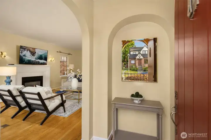 Formal entry that is met from a covered porch and a curved front door Formal entry that is met from a covered porch and a curved front door