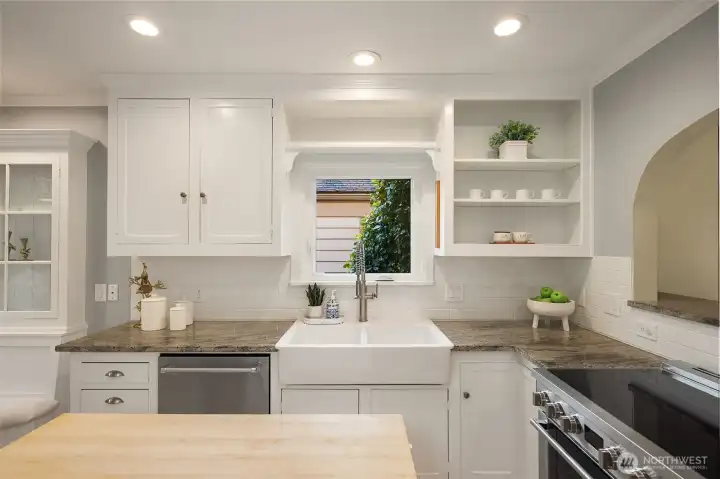 This bright kitchen has been freshly painted and is open to the dining room. The induction range keeps things neat and yet lets the cook do their job. This bright kitchen has been freshly painted and is open to the dining room. The induction range keeps things neat and yet lets the cook do their job.