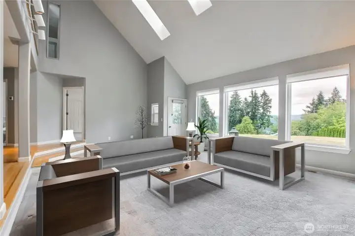 Living room/Great room has soaring vaulted ceiling and skylights Living room/Great room has soaring vaulted ceiling and skylights