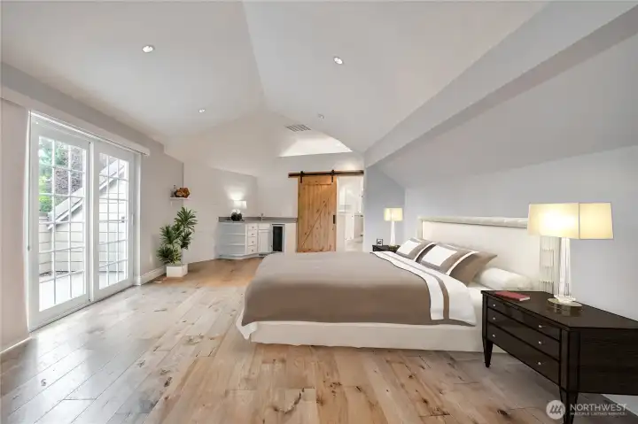 Primary bedroom has updated with engineered hardwood floorings, lightnings, wet bar and sitting area Primary bedroom has updated with engineered hardwood floorings, lightnings, wet bar and sitting area