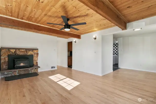 Big open living room with Nice wood beams.