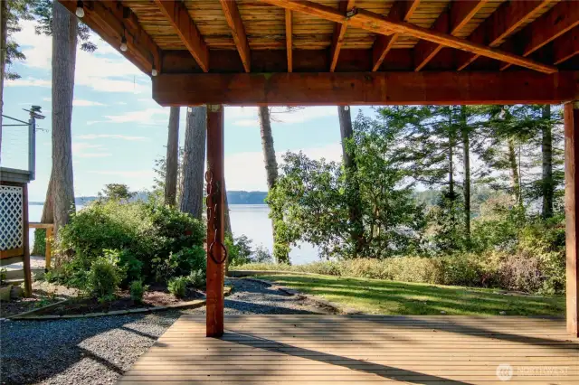 Lower level patio, trail to the beach is on the left side of the back yard