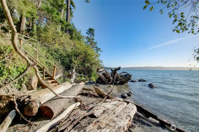 The logs are gone from this area of the beach now. View of stairs that will take you back to the house.