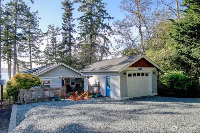 Street view of home, garage, guest and RV/Boat parking. Gravel is in great shape!