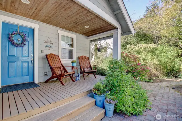 Relaxing covered sitting porch with recessed lighting to welcome you home.