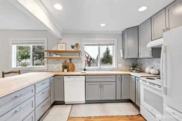 Ample prep space with along the butcher block counters and all appliances stay!