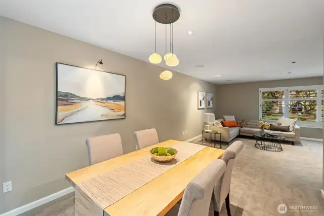 Dining room with an open view of the living room area.