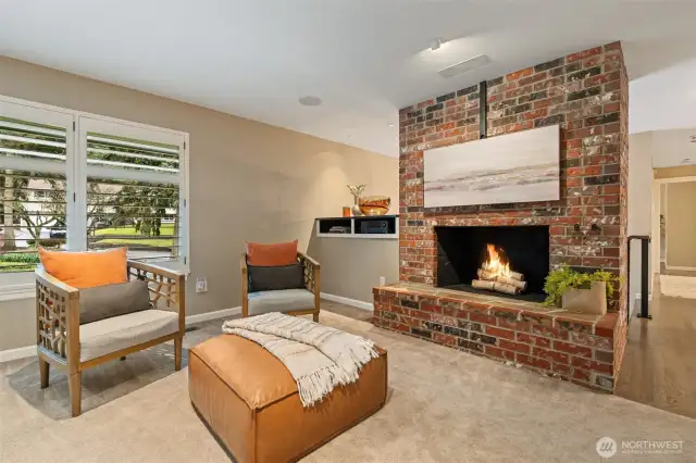 Fireplace with TV mount, wired for surround sound, with ceiling speakers.