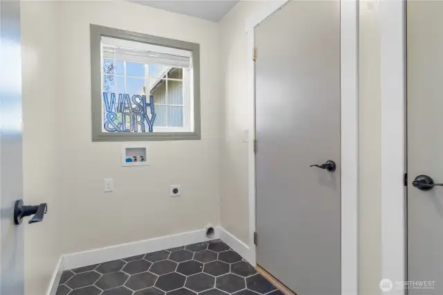 Mudroom & laundry space leads out to your two car garage! Brand new ceramic tile  flooring!
